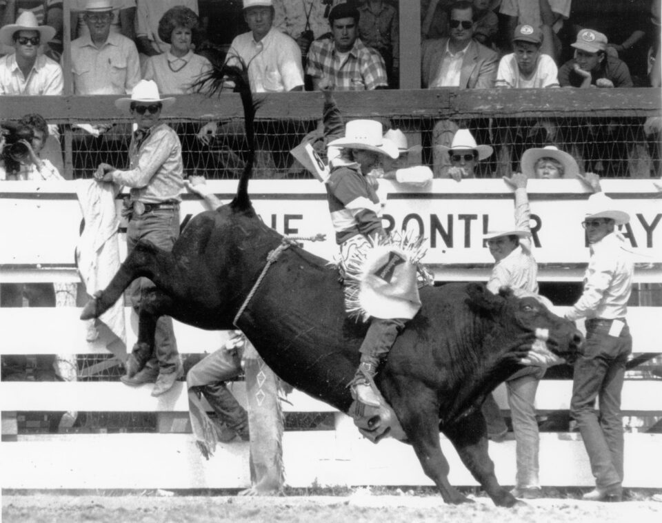 Female bull rider, Jonnie Jonckowski riding at Cheyenne Frontier Days, 1987.